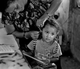 Placing an earring. L1007954.jpg