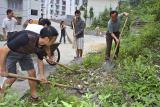 Cleaning up dumped building materials and trash.