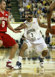 Jackets G Miller reacts to the defensive move by Terrapins G Hayes