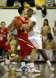 Yellow Jackets G Shumpert stands his ground on defense against Terrapins G Greivis Vasquez