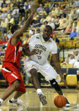 Yellow Jackets F Peacock attempts a drive along the baseline