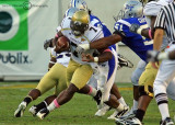 Jackets QB David Sims tries to outrun the Blue Raiders defensive line