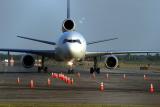Head-on shot of Fedex DC-10, taxi into JFK cargo area