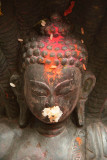 Annointed Buddha Statue with Offerings