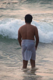 Indian Man in the Sea at Varkala