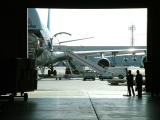 0923 16th Jan 06 Cleaners watching the planes unload Sharjah Airport.JPG