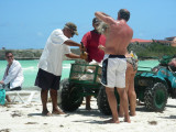 Making coconut drinks on the beach