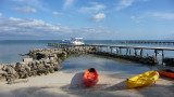 Colorful kayaks on the beach.