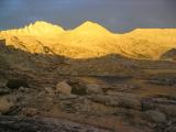 Feather Peak glows golden over Vee Lake in Bear Basin