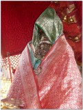 TheerthavAri day -Parthasarathi engulfed in 9 pOrvais (blankets) - closeup.jpg