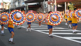 Group of youthful dancers and umbrellas