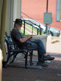Relaxing on a porch - lunchtime on Main street, St. Charles