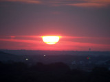 Morning sun disappearing into the clouds
