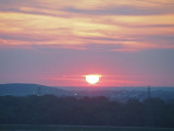 Morning sun disappearing into the clouds