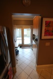 Kitchen looking into small patio room