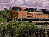 BNSF Engine 9203 rolls through Bellville, TX with freight cars in tow.