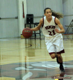 No 21, Courtney Hamilton, dribbles upcourt