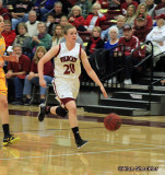 No. 20, Annie Ward, dribbles upcourt