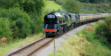 34046 and 34007 drift downhill past Roebuck Farm Crossing.