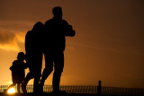 Sunset walkers, Exmouth, Devon