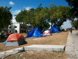 more tents and the office building in the background