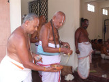 04-Archakas from Melkote taking care of samprokshanam procedures.JPG