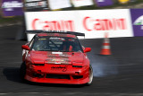 Rhenadi Arinton (Rowdy) from Indonesia driving a red Nissan Silvia 180SX for team Driftbash