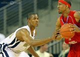 Georgia Tech G Morris checks a Delaware State player as he looks to pass