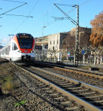 PASSENGER TRAIN NEAR THE LEVEL CROSSING