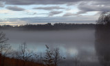 Break in the clouds reflected over the water