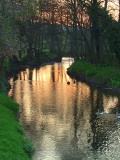The setting sun illuminates the river