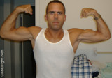 wrestling stud tanktop flexing.jpg