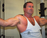 tanktop musclebear biceps flexing.jpg
