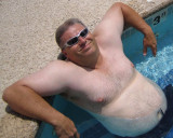 big husky macho man beefy bear swimming poolside.jpg
