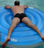 hairy bear man rafting swimming pool party.jpg