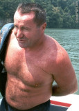 man removing life jacket swimming bear.jpg