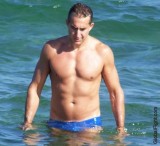 tanned smooth muscle guy swimming dude.jpg