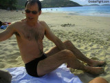 wet guy suntanning on beach soaked man swimming.jpg