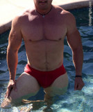wet muscular man swimming.jpeg