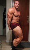 bodybuilder flexing huge calves.jpeg