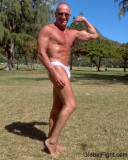 older muscle man body builder flexing outside.jpg