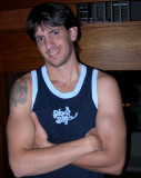 handsome dorm jock stud wearing tanktop posing gay bar.jpg