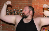 gay bear flexing big arms hairy furry chest.jpg