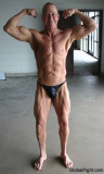 ripped muscular bodybuilder flexing precontest photos.jpg
