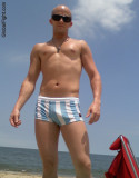 smooth muscleboy suntanning beach hot sands resort pics.jpg