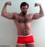 hot bearded muscle stud flexing hugearms.jpg