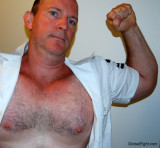 military men flexing arms hairy chests.JPG