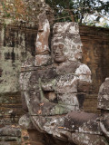 TEMPLE CARVING ON A BRIDGE AT ANGKOR WAT