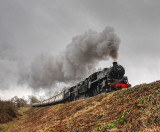 76009 pilots a Class 5 up the bank from Bishops Lydeard to Crowcombe.