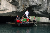 Rowboat passing through Hang Luon Cave into the lagoon